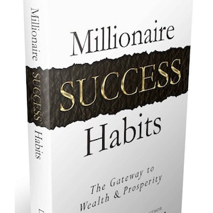 May include: A white book with a black and gold title that reads "Millionaire SUCCESS Habits". The subtitle is "The Gateway to Wealth & Prosperity". The author's name is "Dean Graziosi" and the book is described as "From NY Times Best Selling Author".