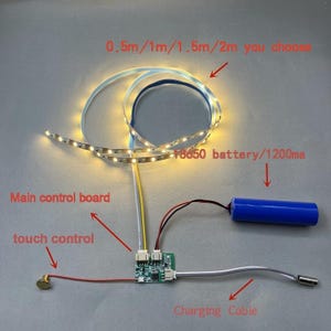 Puede incluir: Una tira de LED iluminada con el texto "0.5m/1m/1.5m/2m you choose" y una batería azul 18650. La imagen también muestra una placa de control principal, control táctil y un cable de carga.