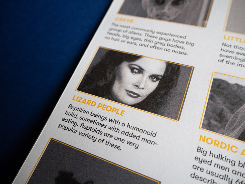 May include: A close-up of a magazine page with a black and white photo of a woman with dark hair and large eyes. The text on the page reads "Lizard People" and describes them as reptilian beings with a humanoid build.