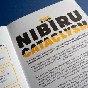 May include: A book cover with the title "The Nibiru Cataclysm" in black and yellow text. The text on the cover discusses the theory of a large planet in our solar system that has not yet been detected.