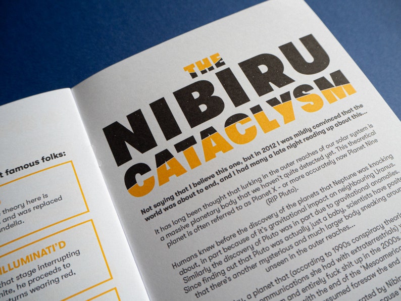 May include: A book cover with the title "The Nibiru Cataclysm" in black and yellow text. The text on the cover discusses the theory of a large planet in our solar system that has not yet been detected.