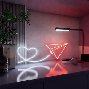 Insegna al neon dell'aeroplano di carta con cuore volante, decorazione della parete dell'aeroplano di carta, arte della parete dell'aeroplano di carta, insegna al neon dell'aeroplano