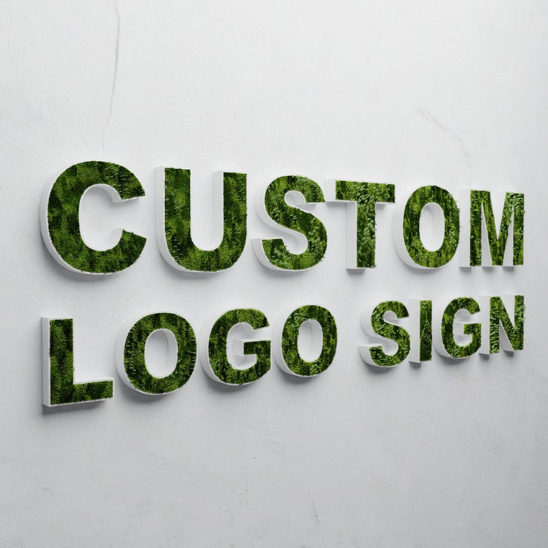 May include: White letters spelling "CUSTOM LOGO SIGN" with green moss growing inside each letter.