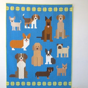 May include: A blue quilt with a border of green and yellow tennis balls. The quilt features a variety of dog breeds in a pixelated style, including a corgi, a dachshund, a pug, and a chihuahua.