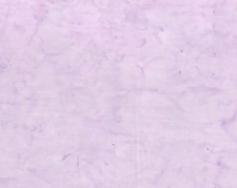 May include: A light purple fabric with a marbled pattern. The fabric has a soft, delicate texture.