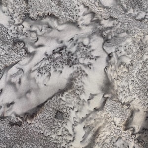 May include: Abstract gray and white fabric with a textured, marbled pattern. The fabric has a subtle shimmer and a soft, flowing feel.