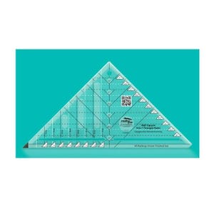 May include: A clear, triangular quilting ruler with black markings and measurements in inches. The ruler is labeled "Half Square 4-in-1 Triangle Ruler" and is designed by Brenda Henning. The ruler is on a teal background.