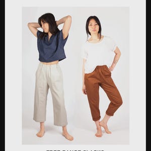 May include: Image of two people modeling clothing. One wears a navy blue top and light beige pants, the other a white top and brown pants. The text "SEW HOUSE SEVEN" and "FREE RANGE SLACKS" are visible. The text also includes "STANDARD SIZES 00-20" and "CONFIDENT BEGINNER".