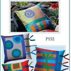 May include: Four square silk pillows with the text Silk Therapy for Pillows! and P152. One pillow features a spiral, one has three circles, one displays a grid of squares, and one shows a green plant motif. All pillows have side ribbon ties.