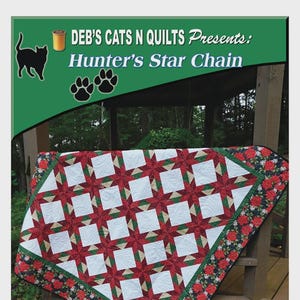 May include: A quilt featuring a Hunter's Star Chain pattern with red, white, and green geometric shapes. The border displays a floral print on a black background. Text at the top reads: DEB'S CATS N QUILTS Presents: Hunter's Star Chain, with cat icons.