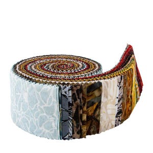 May include: A rolled bundle of fabric strips in various colors and patterns. The fabric roll features a variety of designs, including floral, abstract, and geometric prints. The edges of the fabric are jagged, and the roll is tightly wound.
