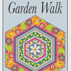 May include: A colorful quilt with a floral design, featuring sunflowers, lemons, and a central flower. The quilt has a hexagonal shape with the text "Garden Walk" at the top. The design incorporates pink, yellow, blue, and green hues.