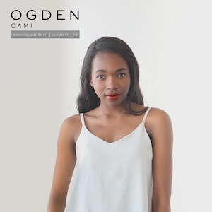 May include: A woman wearing a light blue camisole with thin straps and a V-neck. The image includes the text "OGDEN CAMI" and "sewing pattern sizes 0-18". The camisole is a simple, elegant design.
