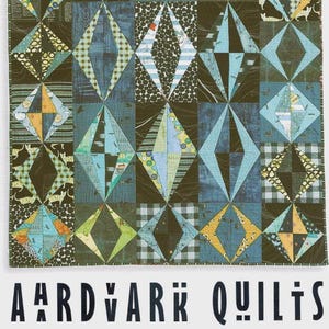 May include: A patchwork quilt with a geometric diamond pattern in shades of blue, green, and yellow. The quilt features various fabric patterns, including stripes, polka dots, and plaid. The text "AARDVARK QUILTS" is displayed at the bottom.