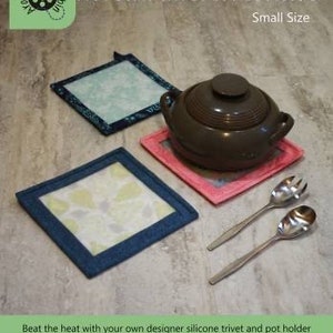 May include: A brown ceramic pot with a lid sits on a pink trivet. Two additional trivets, one blue and one green, are visible. Two stainless steel spoons are also in the image. The text reads "Hot Stuff Trivet & Pot Holder" and "Finishes at approximately 8" square."