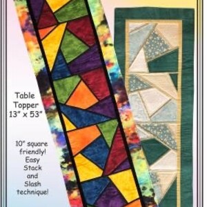 May include: A colorful table topper with a stained glass design, measuring 13 inches by 53 inches. The design features geometric shapes in shades of orange, yellow, green, blue, and purple. The text "Cracked Glass" is displayed at the top.