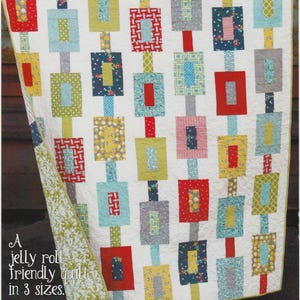 May include: Quilt pattern for a "Off Track" quilt. The quilt is made with a jelly roll of fabric and is available in three sizes. The quilt pattern is designed by Chuck Cluck Sew.