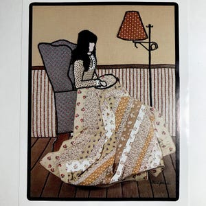 May include: A print illustration of a person with dark hair sitting in a high-backed chair, working on a quilt with floral and paisley patterns. A floor lamp with a patterned shade stands nearby. The scene features striped wallpaper and wood flooring.