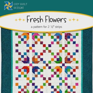 May include: A quilt pattern titled "Fresh Flowers" with a colorful floral design. The quilt features a white background with a repeating pattern of squares in various colors, including red, orange, green, blue, and purple. The pattern is designed for 2 1/2" strips.