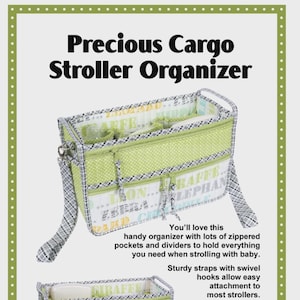 May include: A stroller organizer with the text "Precious Cargo Stroller Organizer." The organizer is light green with white polka dots and animal print patterns. It has multiple zippered pockets and sturdy straps.