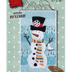 May include: A fabric wall hanging featuring a snowman design. The snowman has a black top hat with a snowflake, a carrot nose, and a colorful striped scarf. The sign reads "Mr. Frosty" and measures 12" x 18".