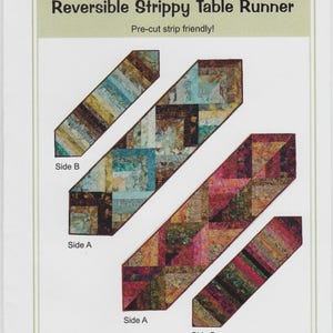May include: A diagram of a reversible strippy table runner with the text "Reversible Strippy Table Runner" and "Pre-cut strip friendly!". The table runner has two sides, Side A and Side B, with different color patterns.