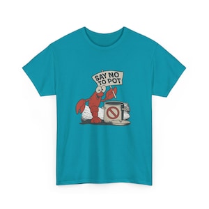 May include: A turquoise t-shirt with a cartoon lobster holding a sign saying "Say No To Pot." The lobster is in front of a pot with a no symbol. The design is in red, white, and black.
