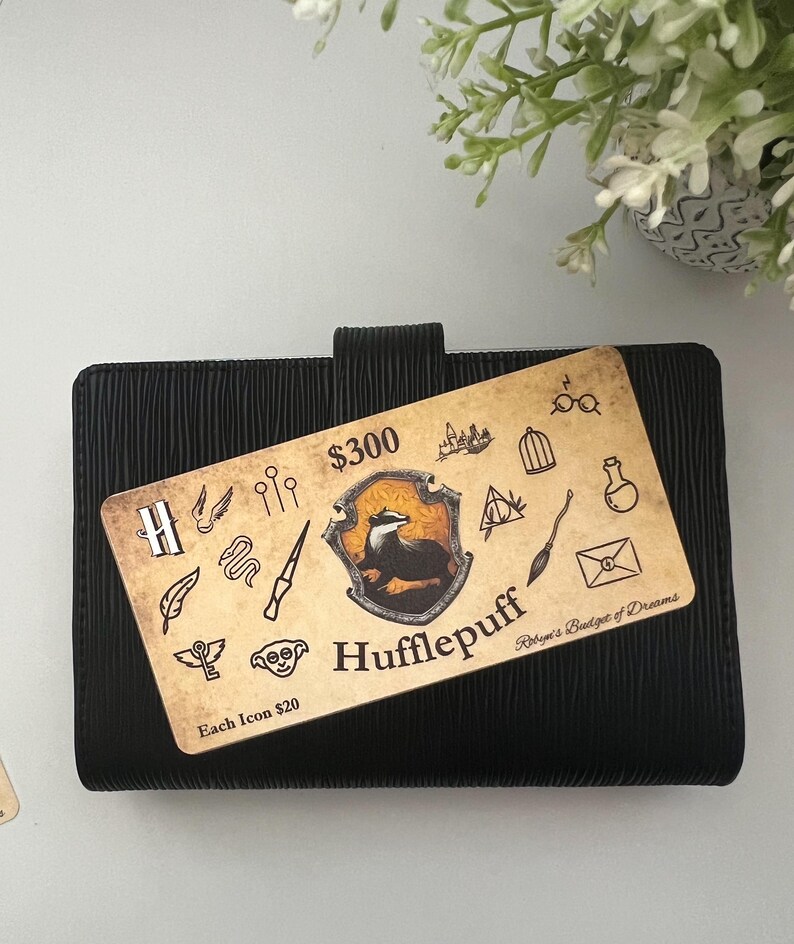 May include: A yellow and black Hufflepuff house crest with a badger on a black background. The crest is surrounded by various Harry Potter themed icons. The text "$300" and "Each Icon $20" is visible. The text "Robyn's Badge of Dreams" is also visible.