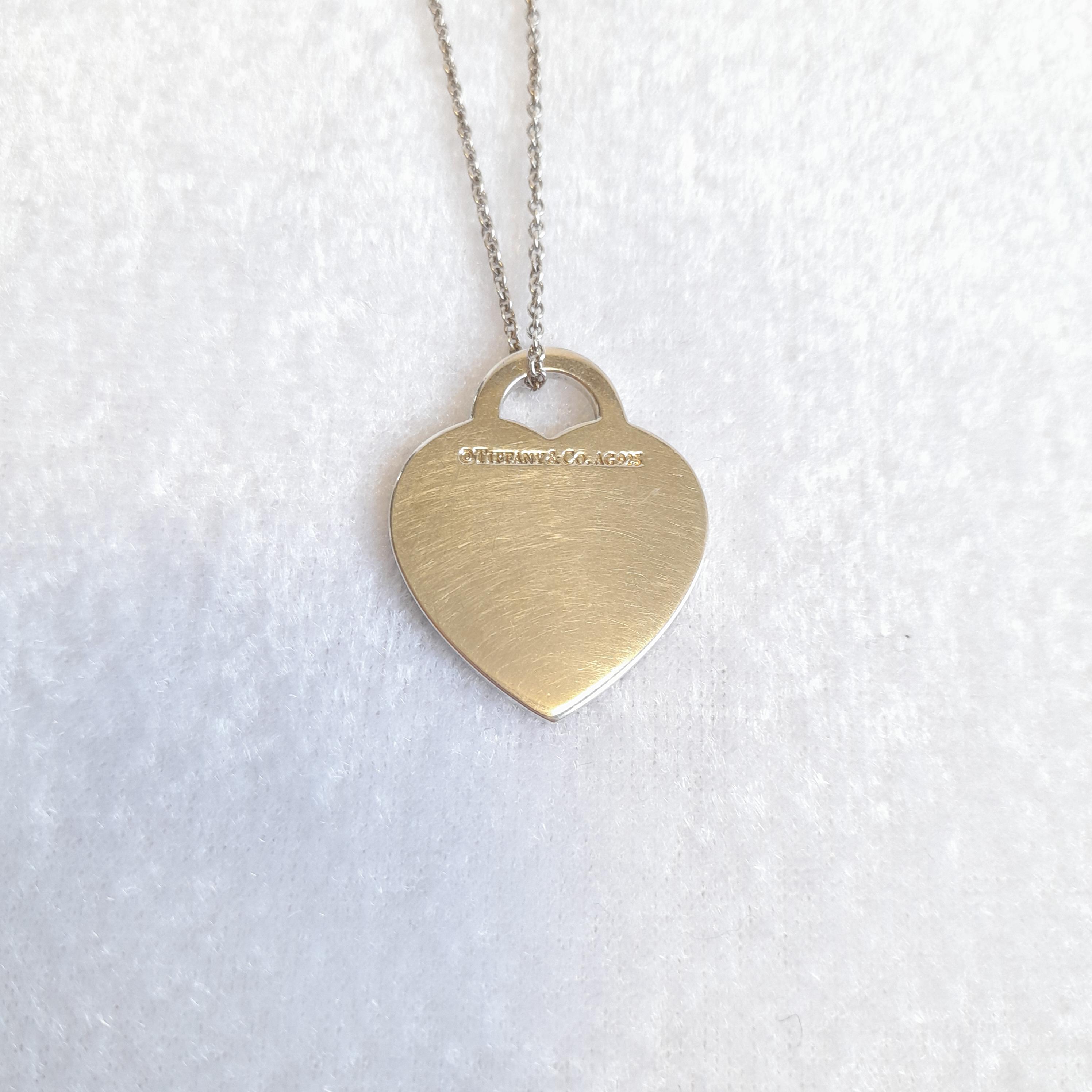 Tiffany and Co Etched Heart & Arrow Tag Pendant Return to