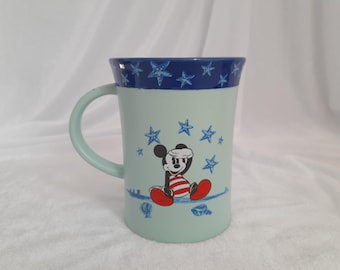 Taza de café vintage de los parques Disney con Mickey Mouse, década de 1980.