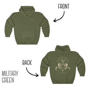 May include: A military green hoodie with a white graphic of a skull with horns and the text "Memento Mori" on the back. The front of the hoodie is plain.