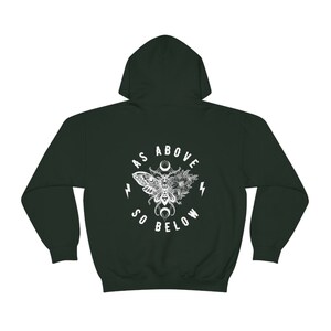 May include: Dark green hooded sweatshirt with a white graphic print of a moth with wings spread, surrounded by flowers and the text "As Above So Below".