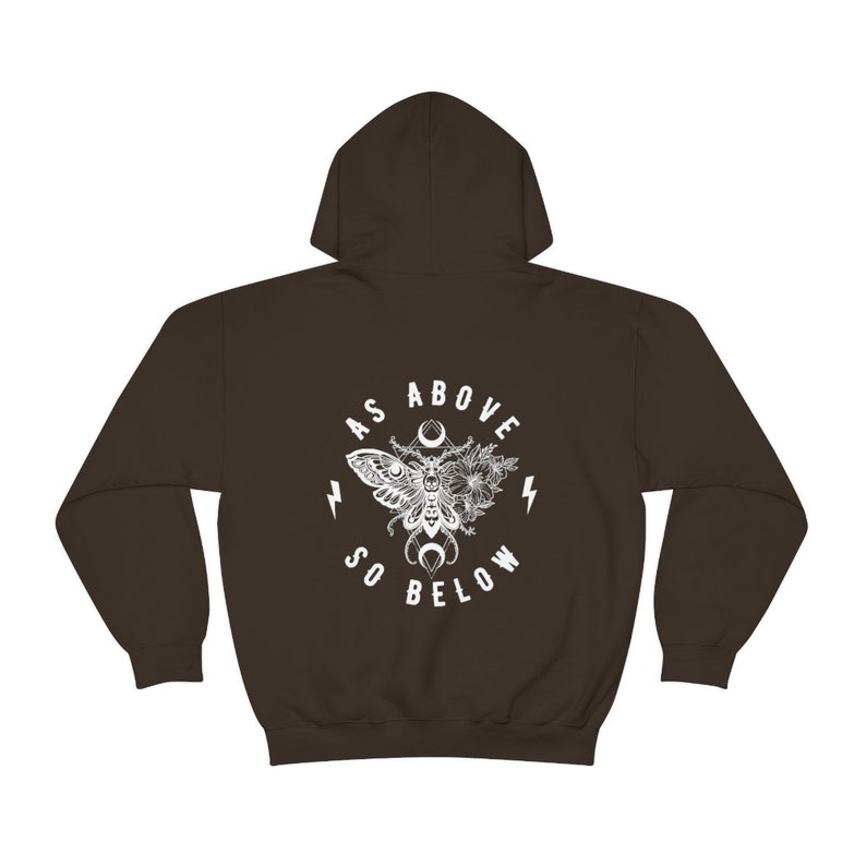 May include: A brown hooded sweatshirt with a white graphic print of a moth with wings spread, surrounded by flowers and the text "As Above So Below".