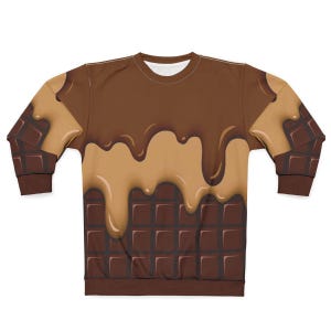 Op de afbeelding: Een bruine sweatshirt met een chocoladereep ontwerp. Het bovenste deel van het kledingstuk is donkerbruin met lichtbruine druppels, en de onderkant heeft een chocoladereep patroon.