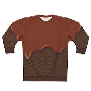 Op de afbeelding: Een bruin sweatshirt met een wafelpatroon aan de onderkant en een bruin chocolade-achtig ontwerp dat van bovenaf druppelt.