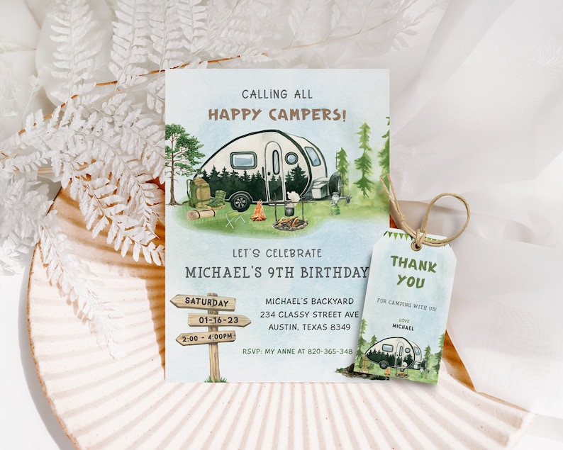 May include: A camping-themed birthday invitation with a cartoon illustration of a camper van, a campfire, and a sign that says "Let's Celebrate Michael's 9th Birthday". The invitation includes details for the party, including the date, time, and location. A thank you tag with a similar illustration is also included.