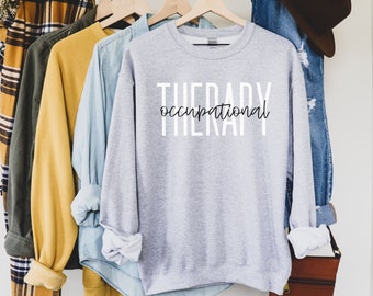 May include: Gray sweatshirt with the text "THERAPY occupational" printed in black on the front.
