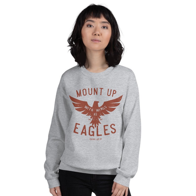 May include: Gray sweatshirt with a red eagle graphic and the text "Mount Up With Wings As Eagles Isaiah 40:31".