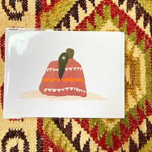 May include: A digital illustration of two people sitting under a blanket with a floral pattern. The blanket is red, orange, and white. The people are facing away from the viewer. The person in the back has long dark hair with a flower in it.