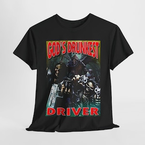 May include: Black t-shirt with a graphic print of a group of figures holding guns. The text "God's Drunkest Driver" is printed in red letters.