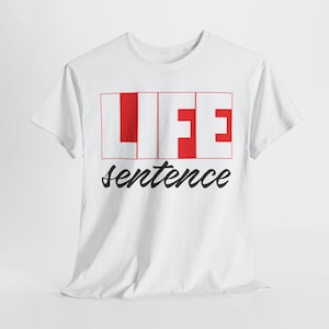 May include: White t-shirt with a red and black graphic that says "LIFE sentence".