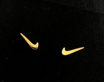 nike gold studs