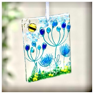 Fused glass blue flower suncatcher with bee.