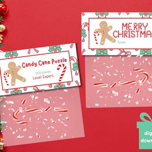 May include: Two Christmas-themed gift tags and a candy cane puzzle. One tag reads "Merry Christmas" with a gingerbread man illustration. The other tag says "Candy Cane Puzzle" with 1452 pieces and an expert level.