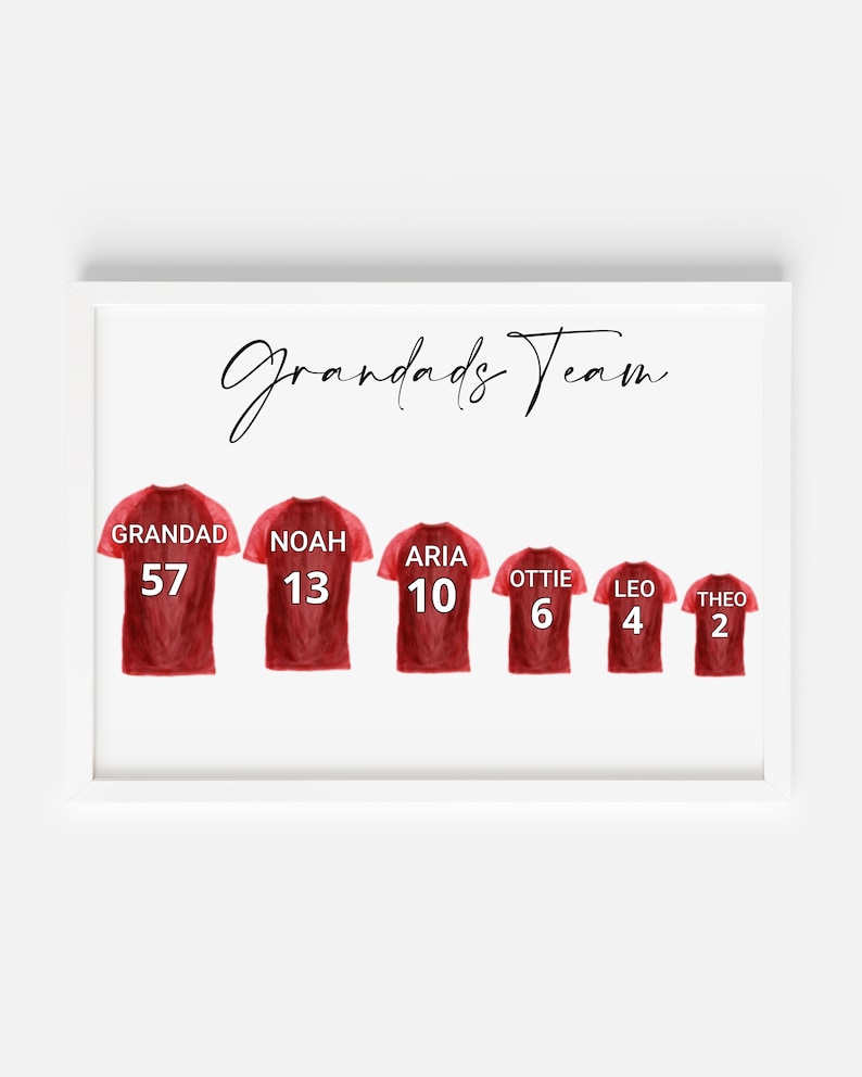 May include: A white framed print with the text "Grandads Team" at the top.  There are six red football shirts with names and numbers on them: Grandad 57, Noah 13, Aria 10, Ottie 6, Leo 4, and Theo 2.