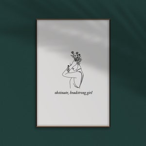 May include: A black and white line drawing of a person with flowers on their head. The text "obstinate, headstrong girl" is below the drawing.