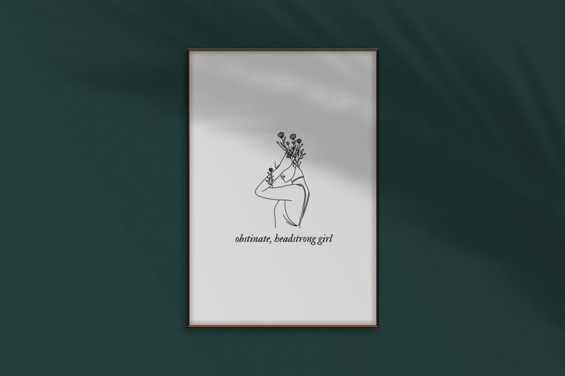 May include: A black and white line drawing of a person with flowers on their head. The text "obstinate, headstrong girl" is below the drawing.