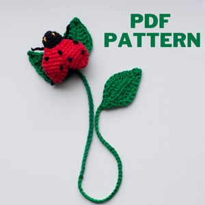 May include: Crochet ladybug bookmark with green leaves and a long green stem. PDF PATTERN.