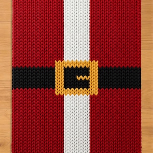 May include: A rectangular knitted textile featuring a red background with a vertical white stripe down the centre and a horizontal black stripe across the middle, accented by a yellow square buckle design centred on the intersection of the stripes.