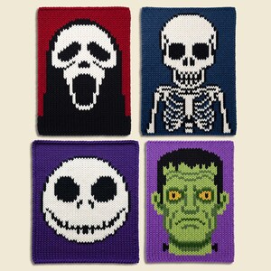 May include: Four rectangular knitted panels featuring horror-themed designs. The top left is a white ghost mask on red. The top right is a white skeleton on blue. The bottom left is a white skull on purple. The bottom right is a green monster on purple.